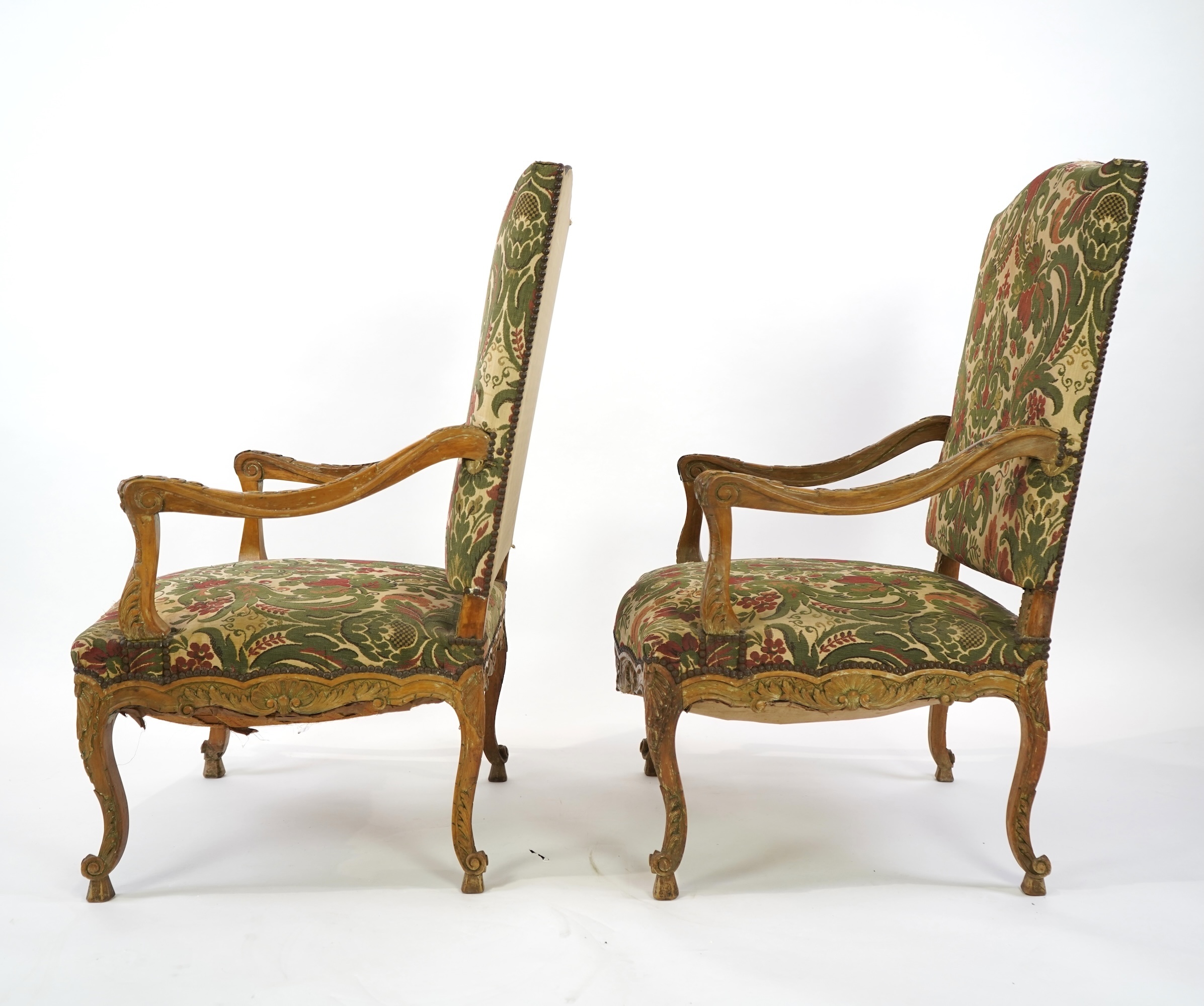 A pair of 19th century Louis XV style carved walnut grand fauteuil